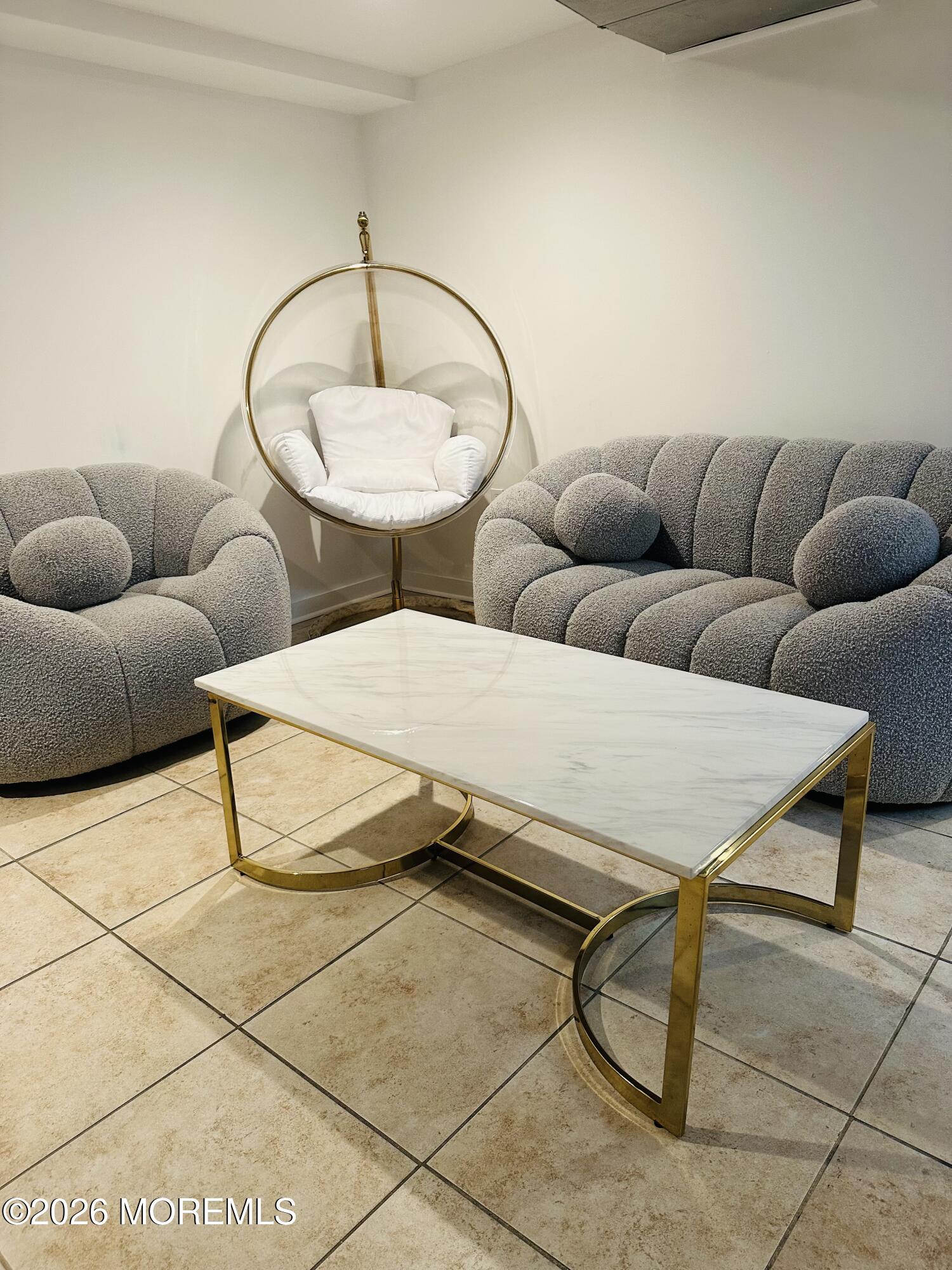175 Delaware Avenue Oakhurst, NJ 07755 - Photo 18 of 24 a living room with furniture a rug and white walls
