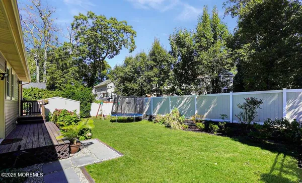 a view of a backyard with sitting area