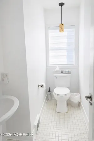 a bathroom with a toilet and a bathtub