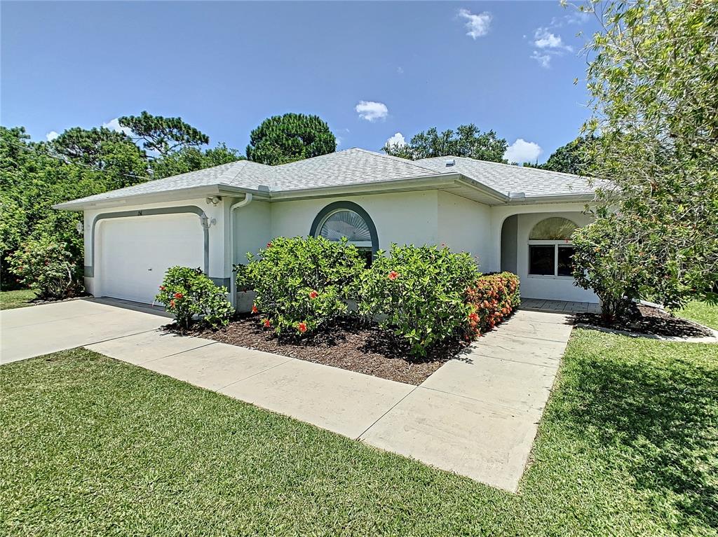 156 Albatross Road Rotonda West, FL 33947 - Photo 1 of 1 Walk leading to the front entrance. Note all the nice mature landscaping and green lawn irrigated from the canal and saves you on your water bill.