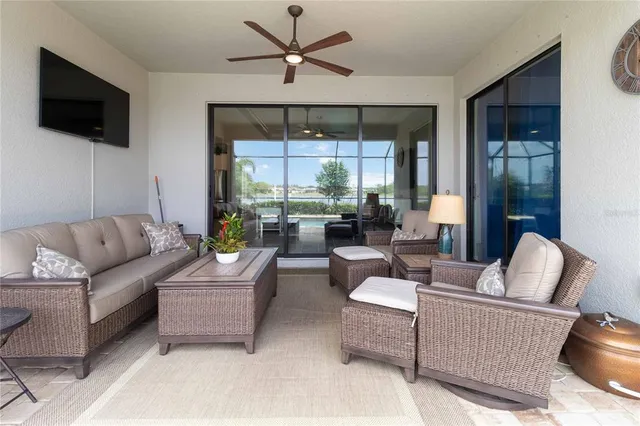 a view of a backyard of a house with yard and outdoor seating