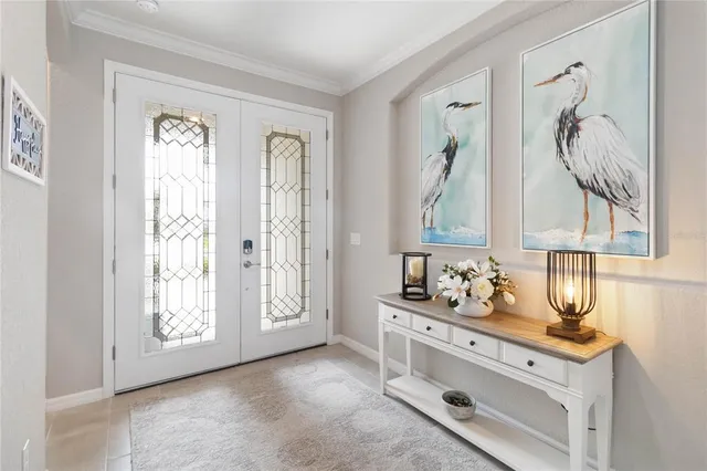 a bathroom with a double vanity sink mirror and next to a window