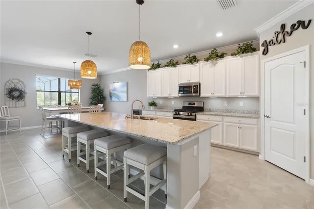 a kitchen with cabinets a sink and appliances