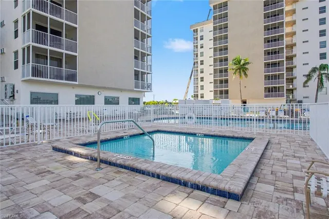 a view of a swimming pool with a lounge chairs