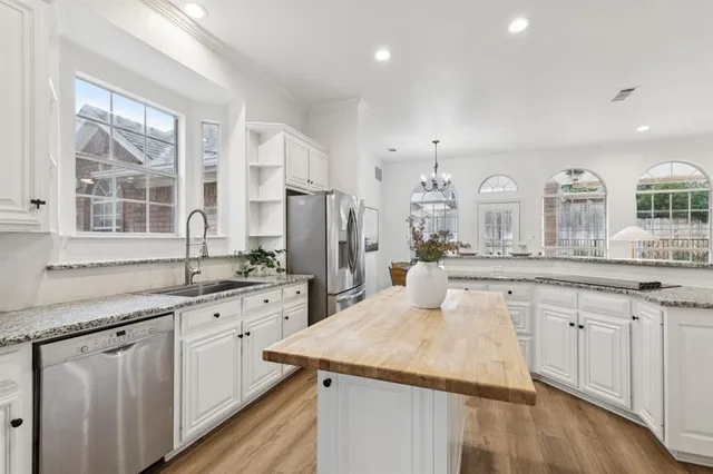 a large kitchen with a lot of counter space and a sink