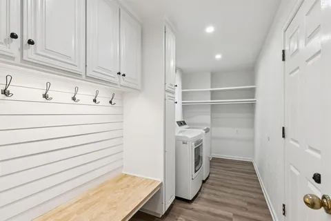 a room with a white wall storage and utility