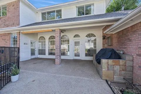 a view of a swimming pool with a patio