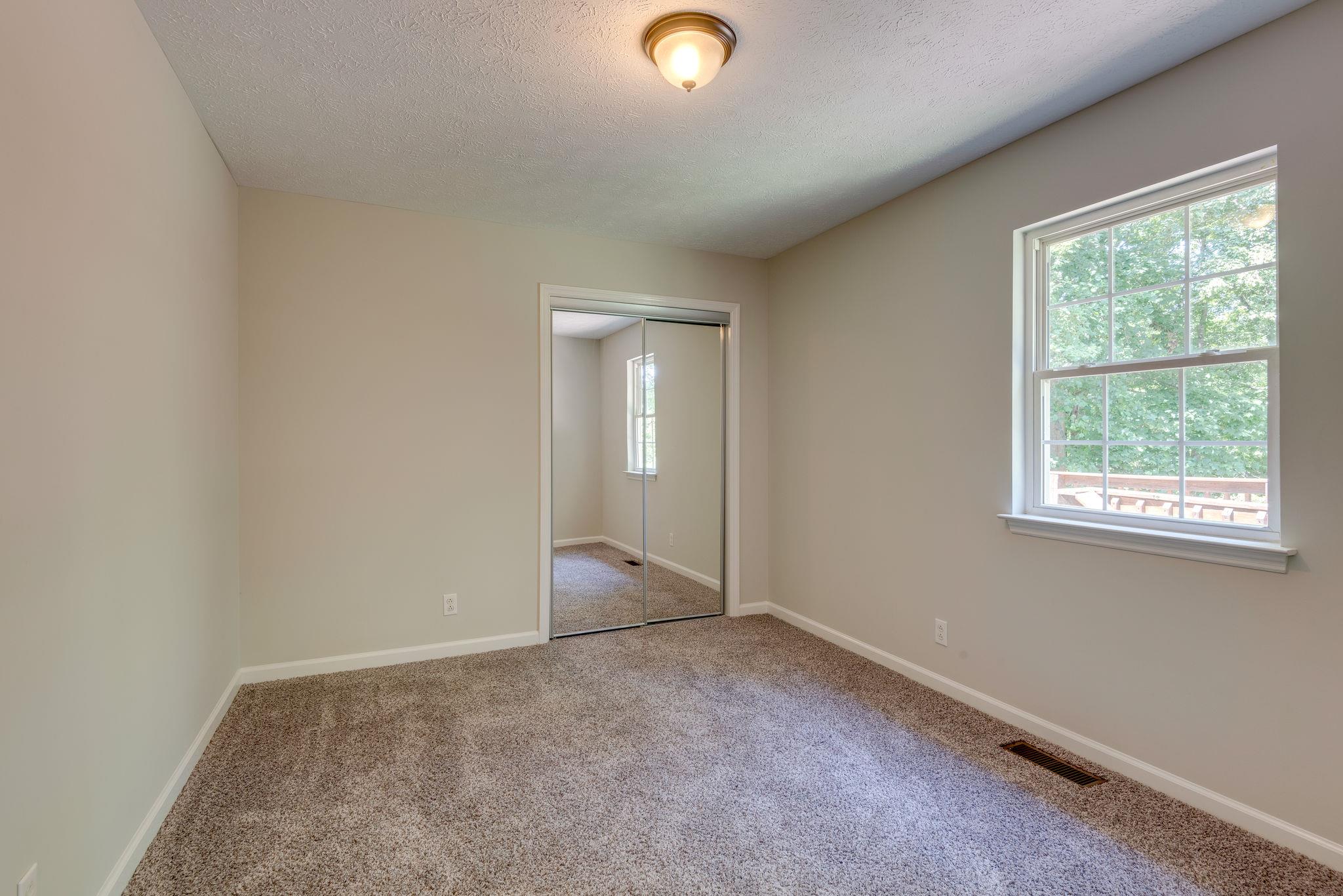 149 Brookside Point Springfield, TN 37172 - Photo 22 of 25 an empty room with windows and closet