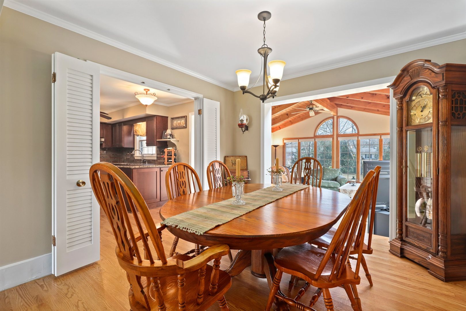 303 Roberts Road Inverness, IL 60067 - Photo 16 of 48 a dining room with furniture a chandelier and wooden floor