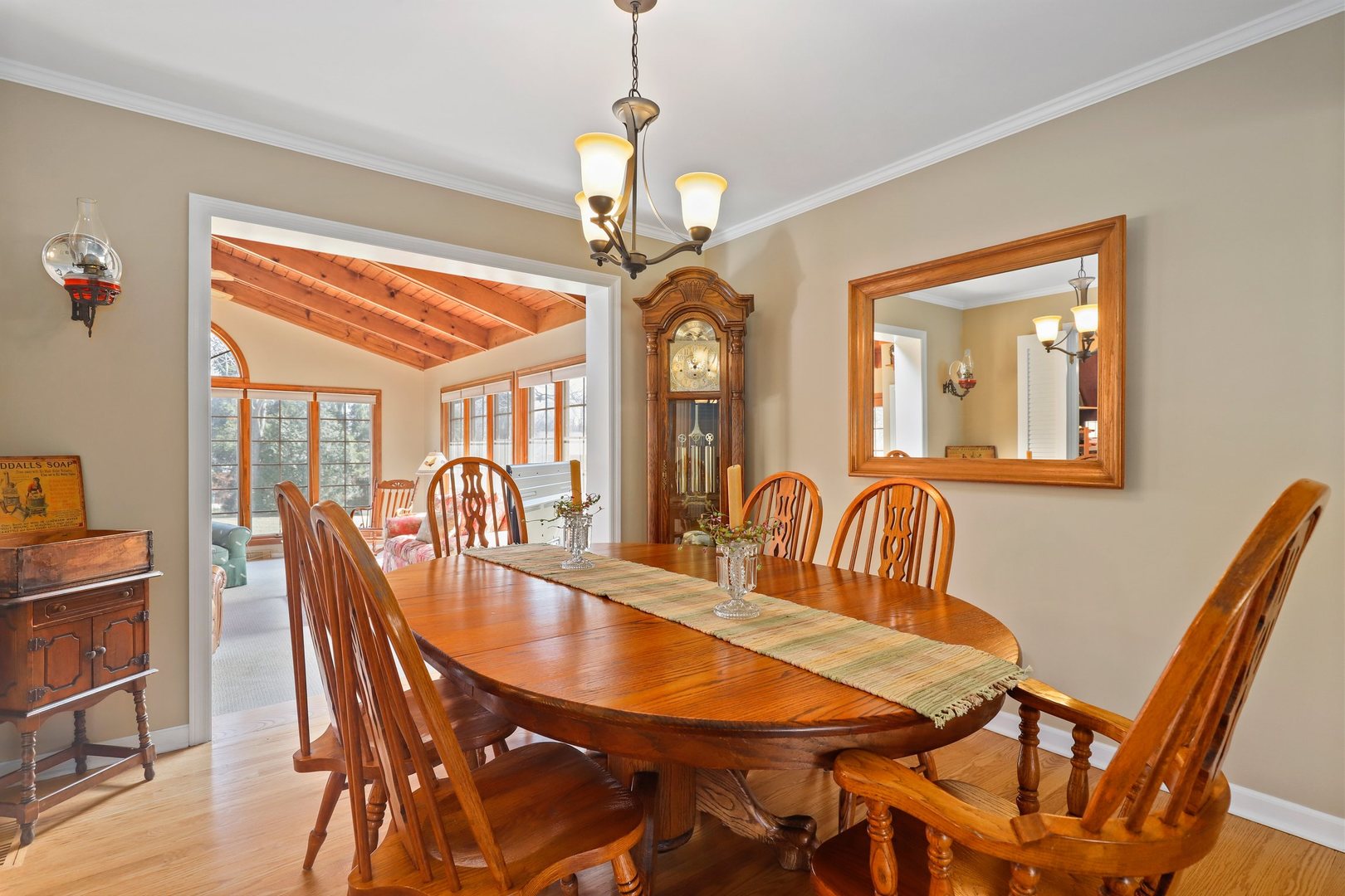 303 Roberts Road Inverness, IL 60067 - Photo 17 of 48 a dining room with furniture a chandelier and wooden floor