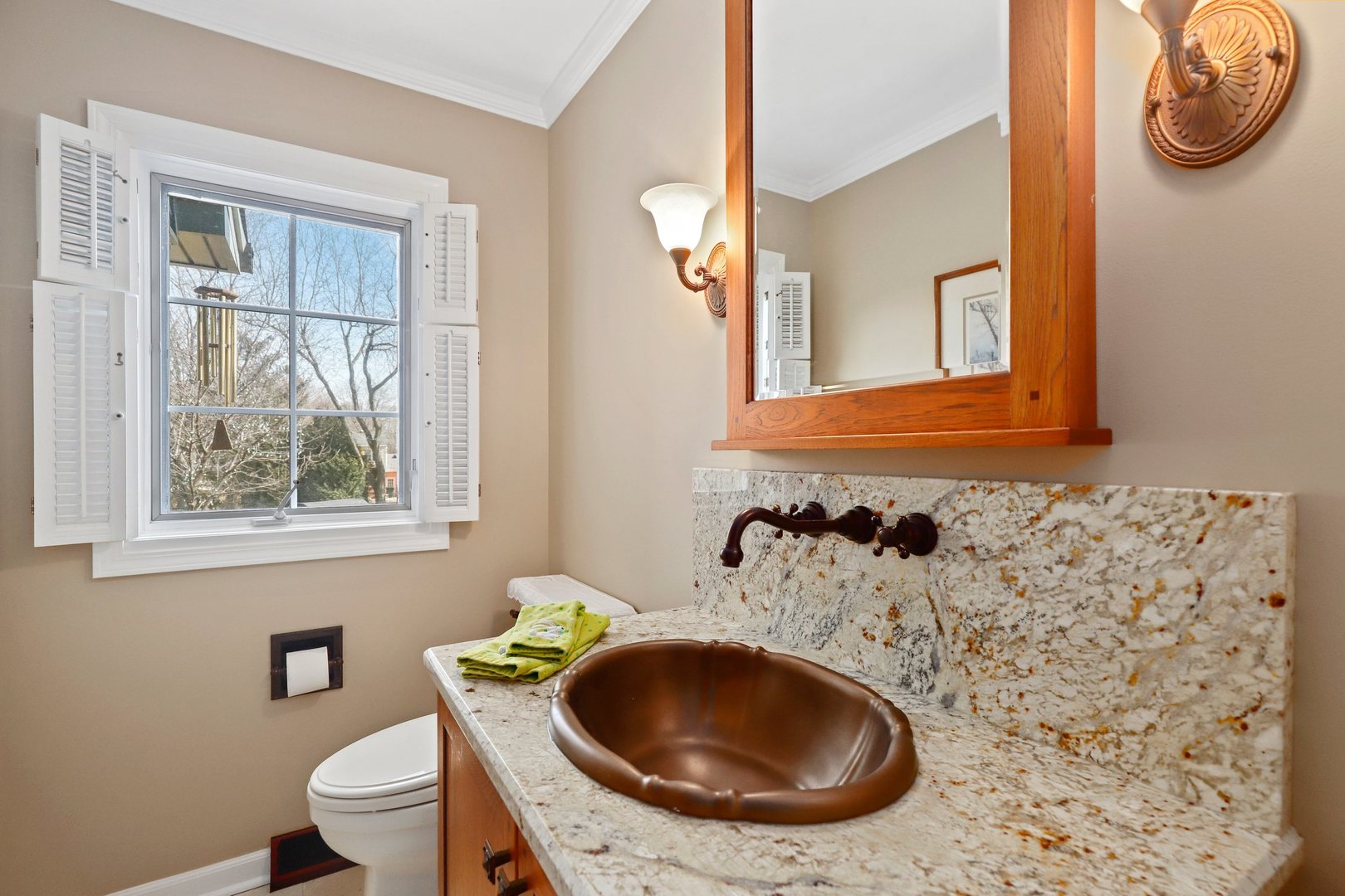 303 Roberts Road Inverness, IL 60067 - Photo 23 of 48 a bathroom with a toilet sink and mirror