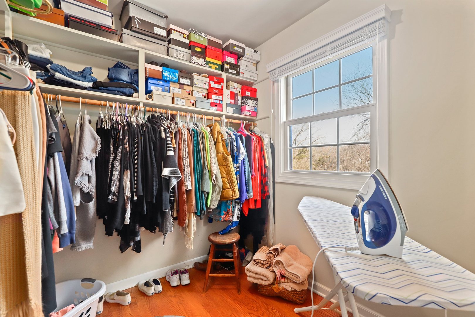 303 Roberts Road Inverness, IL 60067 - Photo 27 of 48 a view of walk in closet with clothes and shoes