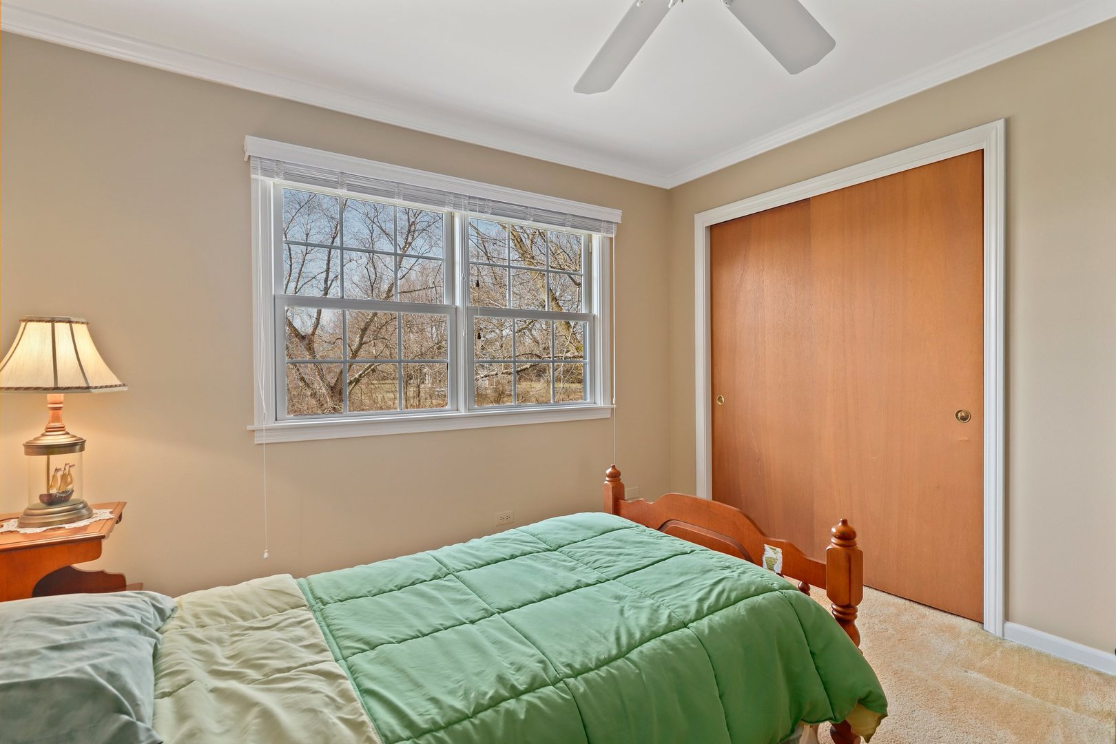 303 Roberts Road Inverness, IL 60067 - Photo 29 of 48 a bedroom with a bed and a window