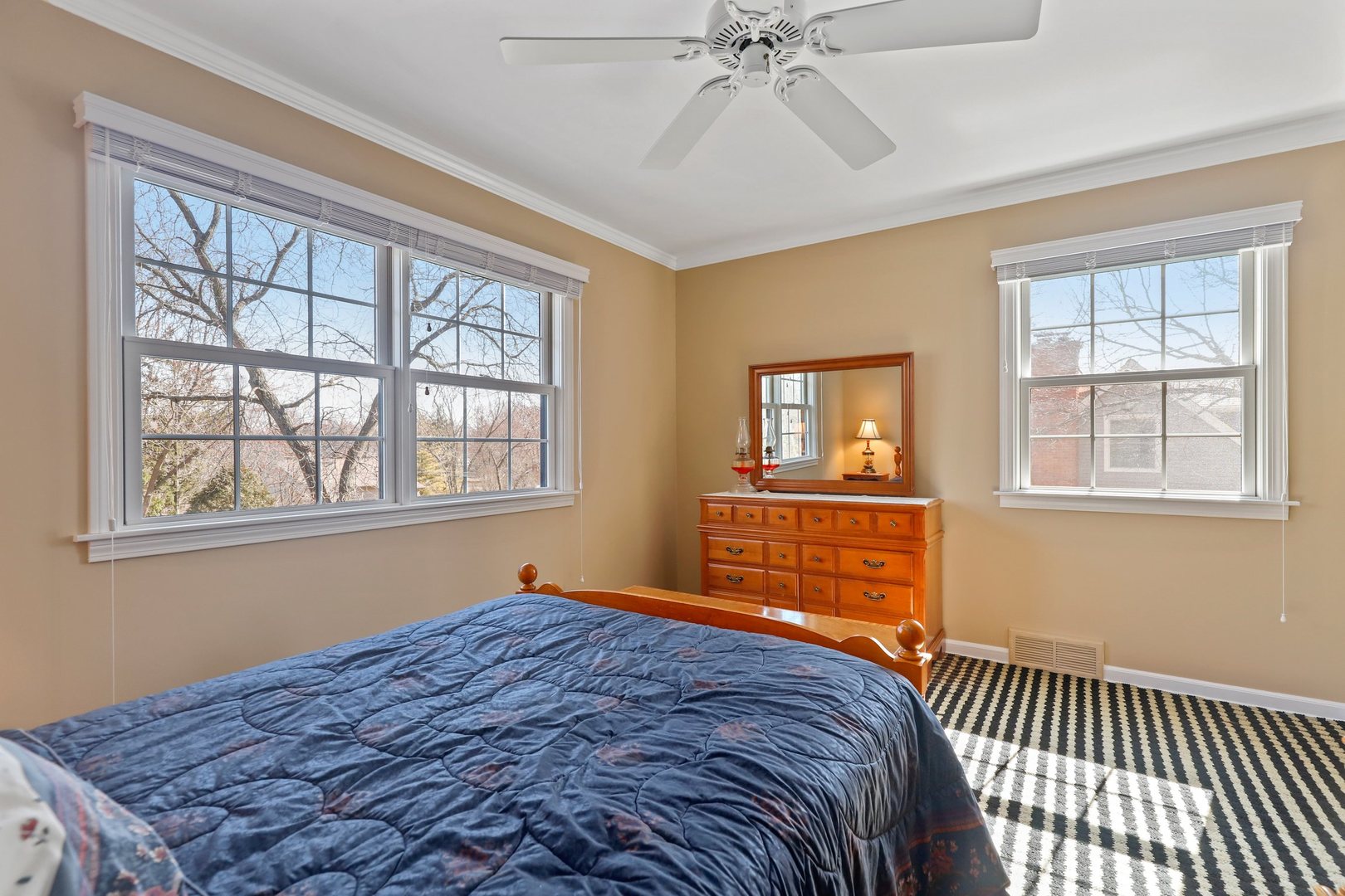303 Roberts Road Inverness, IL 60067 - Photo 30 of 48 a bedroom with a bed and wooden floor