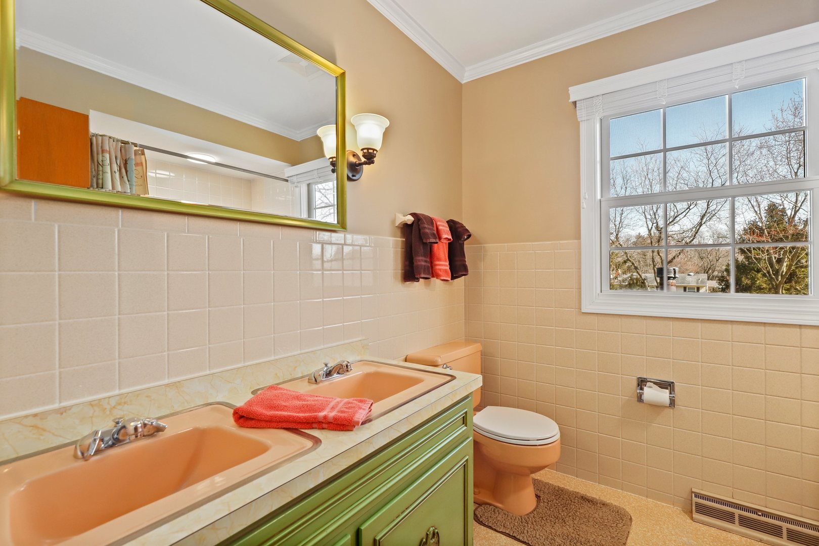 303 Roberts Road Inverness, IL 60067 - Photo 31 of 48 a bathroom with a sink and a mirror