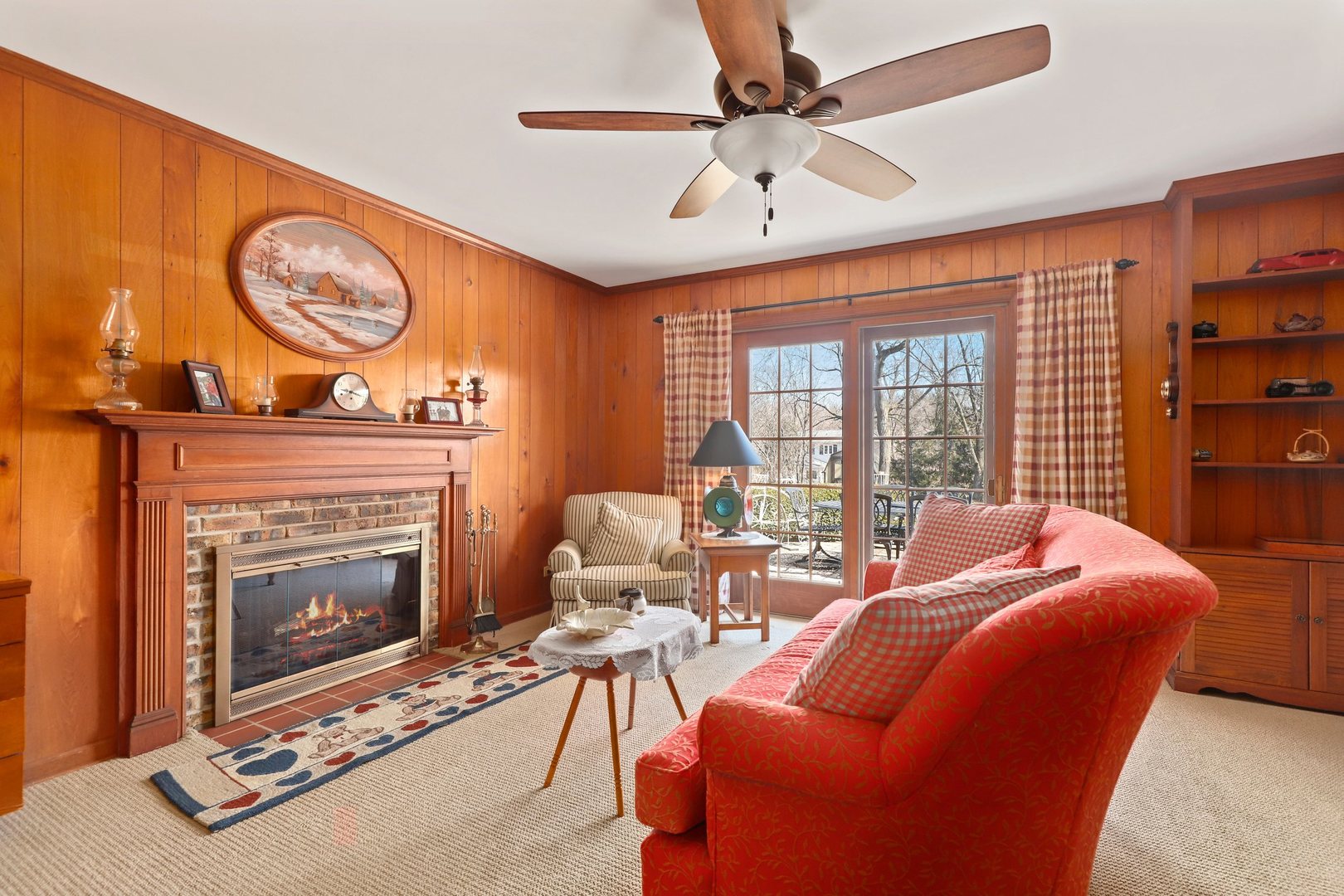 303 Roberts Road Inverness, IL 60067 - Photo 32 of 48 a living room with furniture a fireplace and a large window