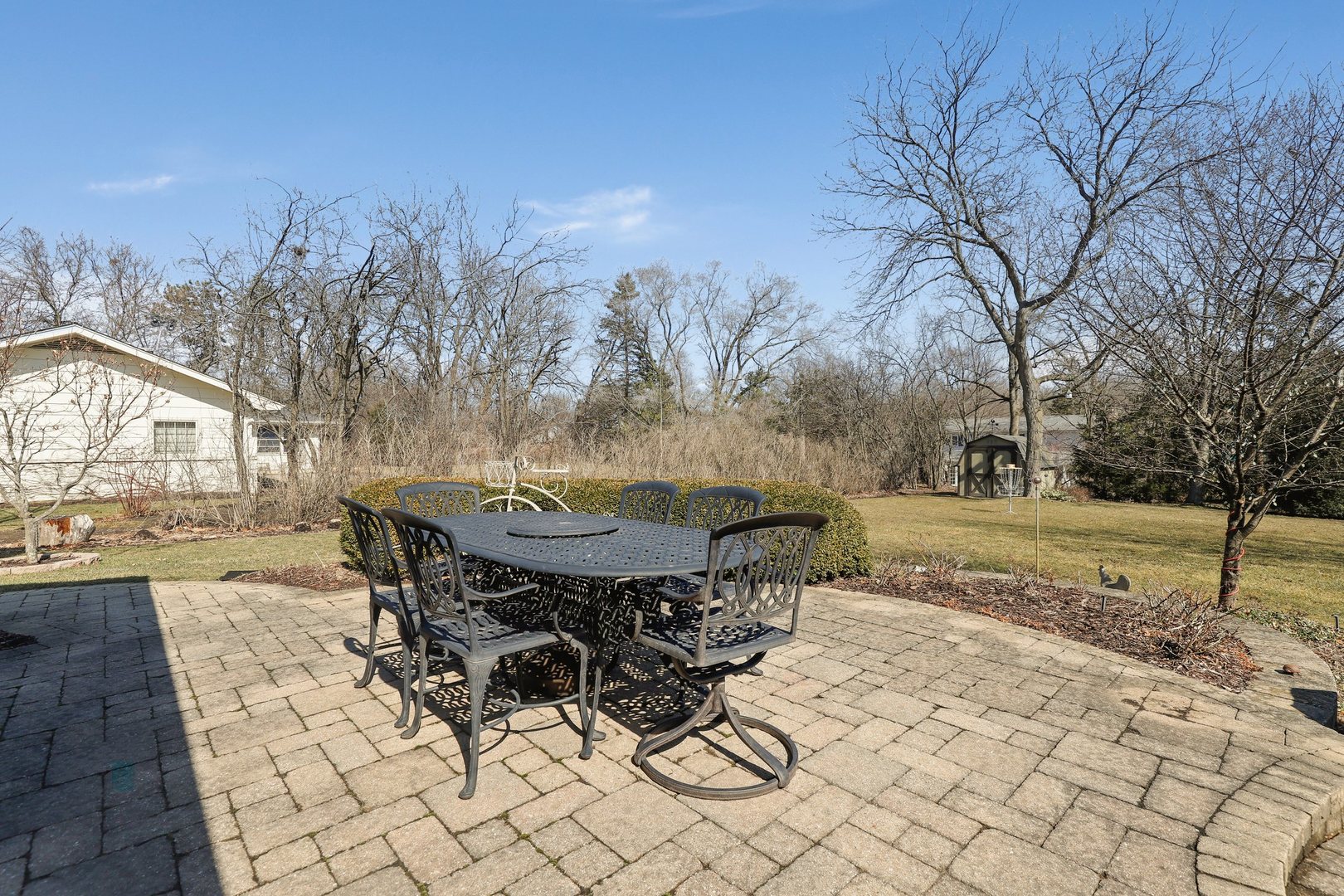303 Roberts Road Inverness, IL 60067 - Photo 36 of 48 a view of a backyard with sitting area