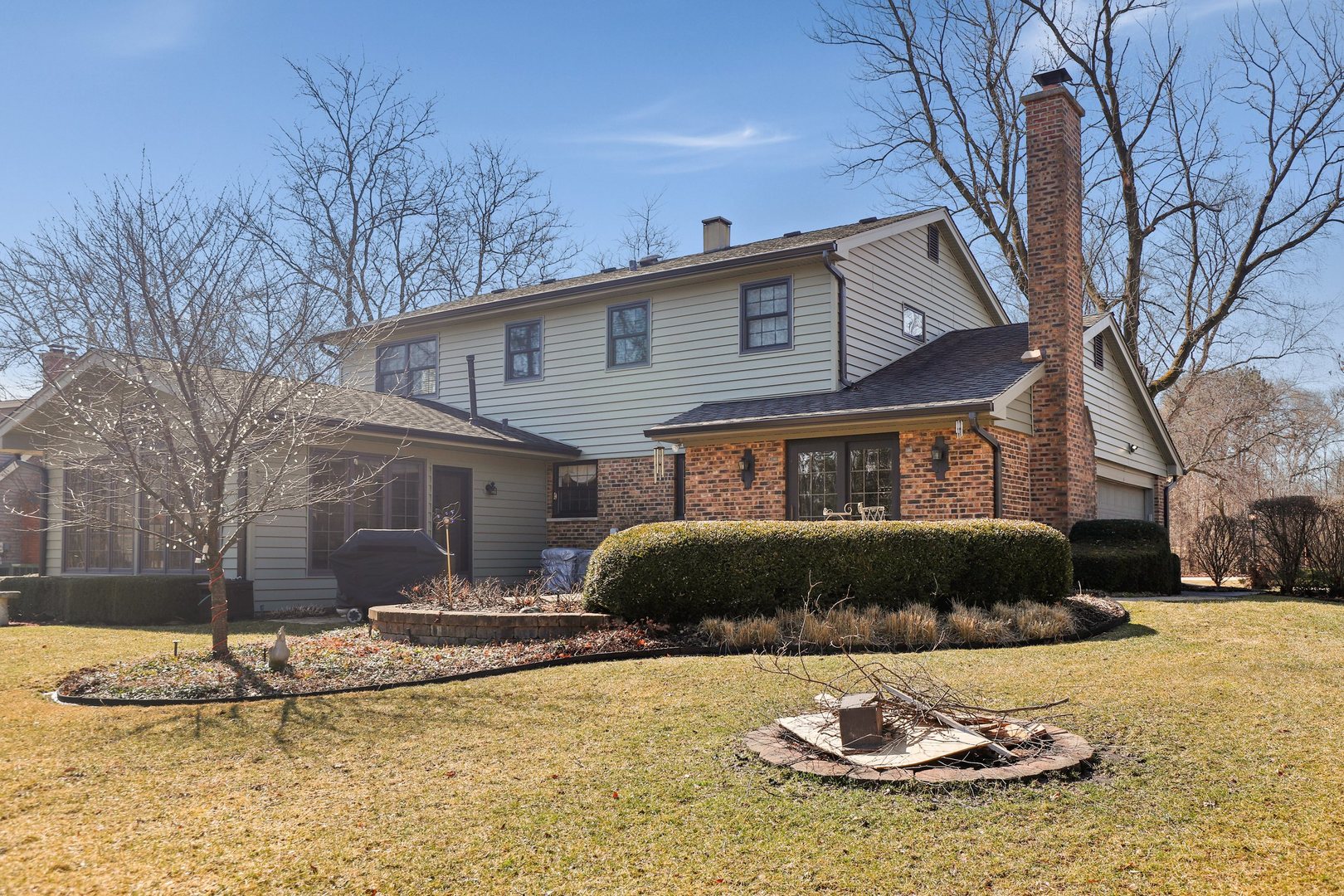 303 Roberts Road Inverness, IL 60067 - Photo 45 of 48 a front view of a house with a yard