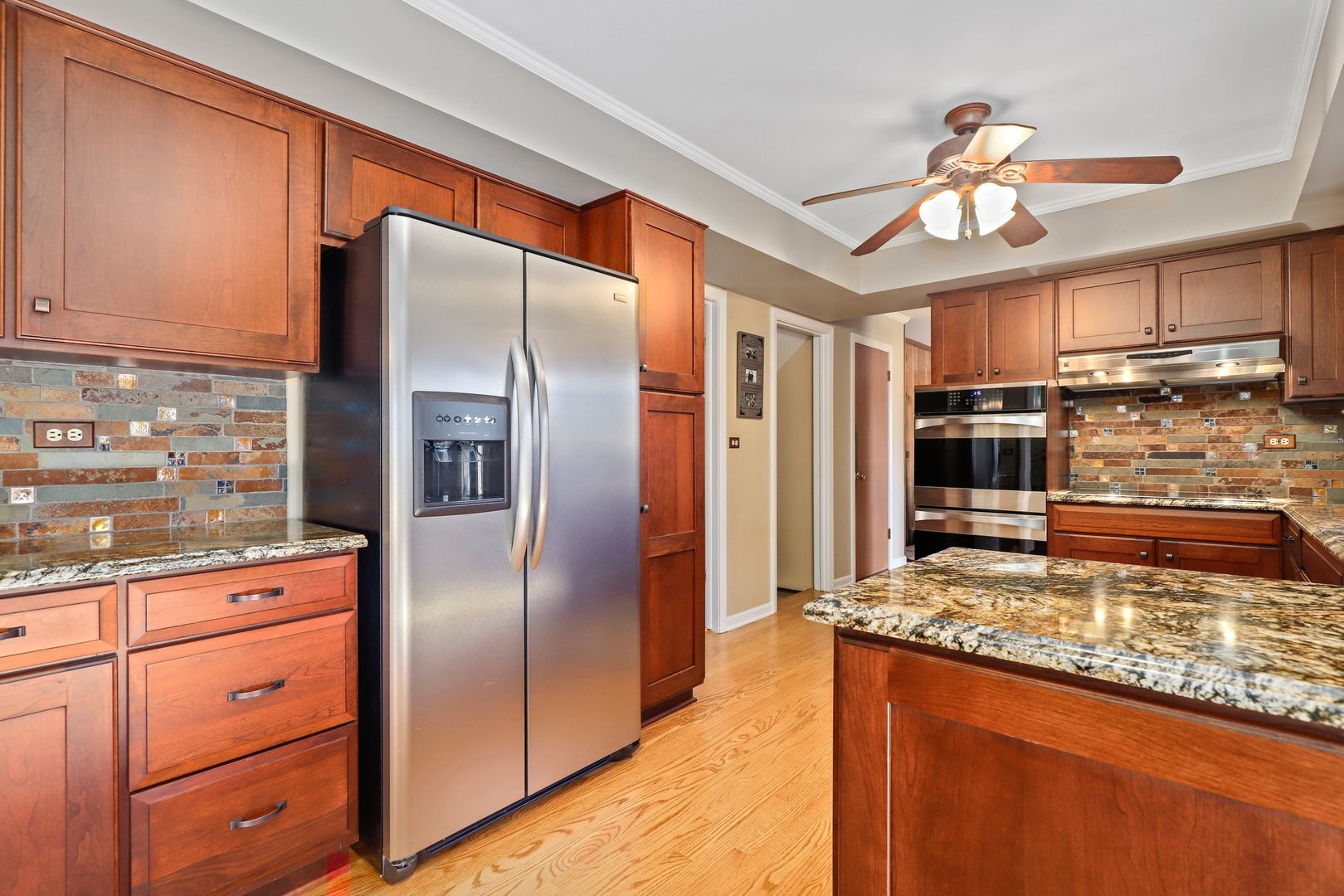 303 Roberts Road Inverness, IL 60067 - Photo 9 of 48 a kitchen with stainless steel appliances granite countertop a refrigerator and a stove