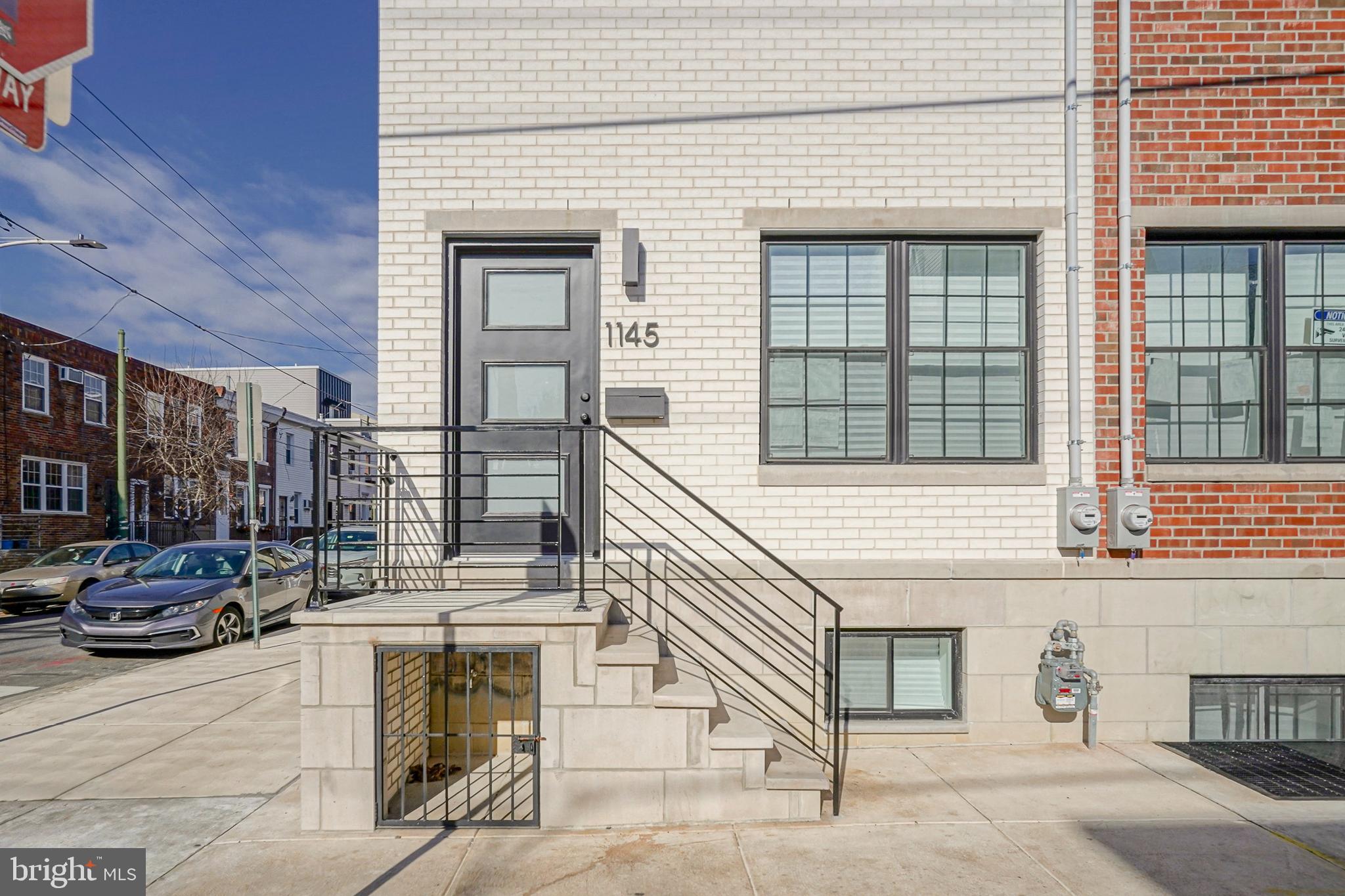 1145 Tasker Street Philadelphia, PA 19148 - Photo 2 of 58 a front view of a house with a garage
