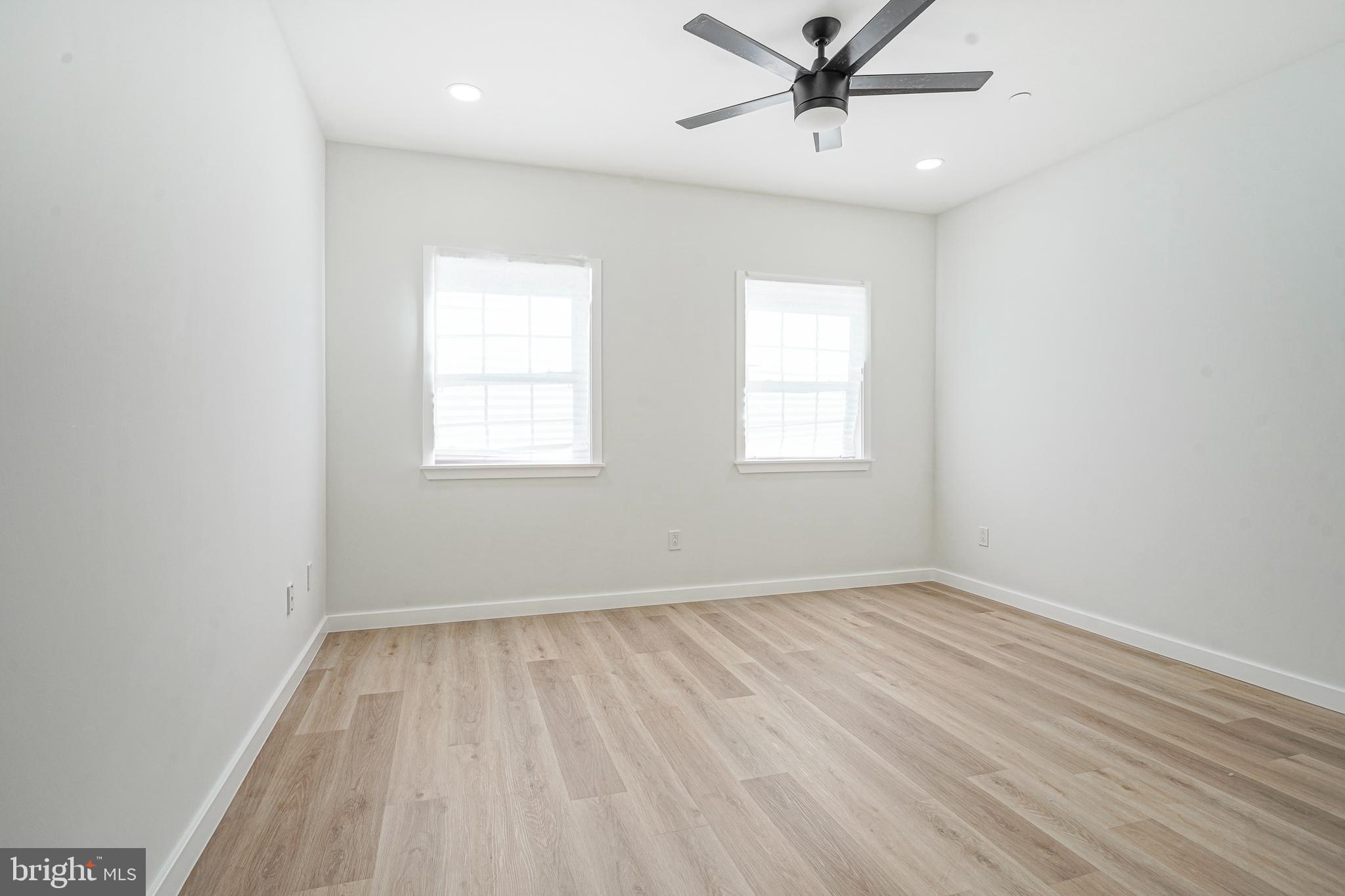 1145 Tasker Street Philadelphia, PA 19148 - Photo 22 of 58 wooden floor in an empty room with a window