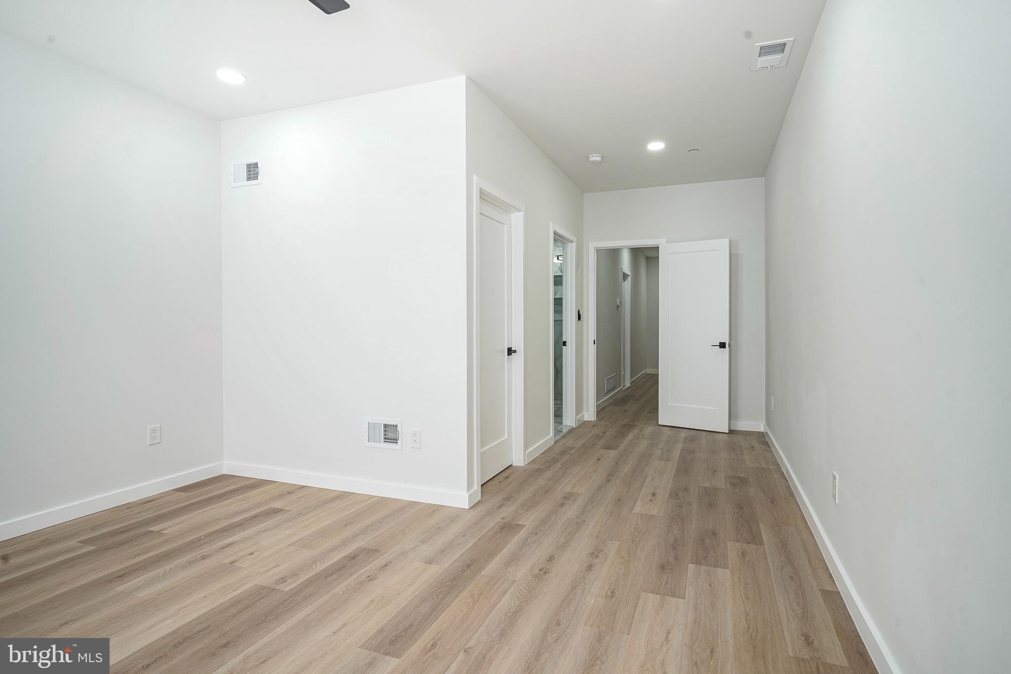1145 Tasker Street Philadelphia, PA 19148 - Photo 23 of 58 a view of a hallway with wooden floor