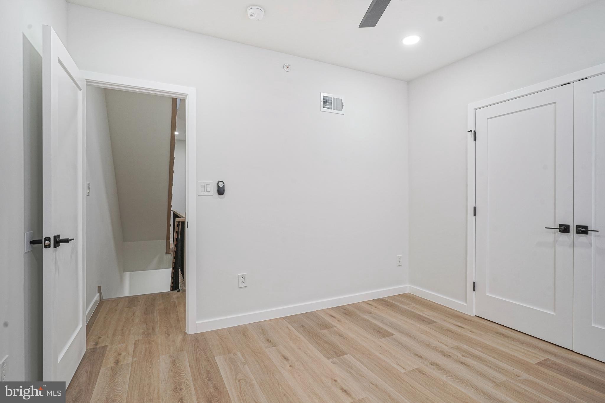 1145 Tasker Street Philadelphia, PA 19148 - Photo 28 of 58 a view of a hallway with wooden floor