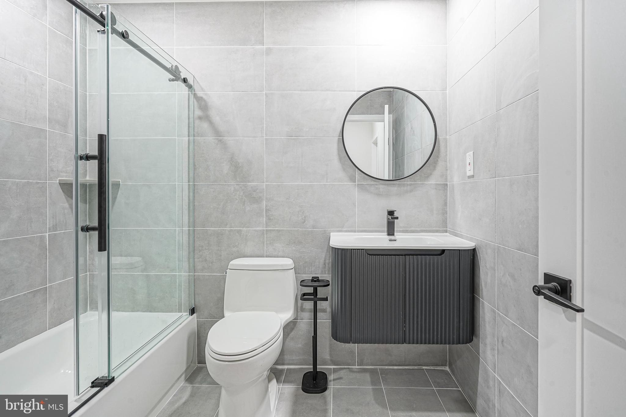 1145 Tasker Street Philadelphia, PA 19148 - Photo 29 of 58 a bathroom with a toilet sink and a shower