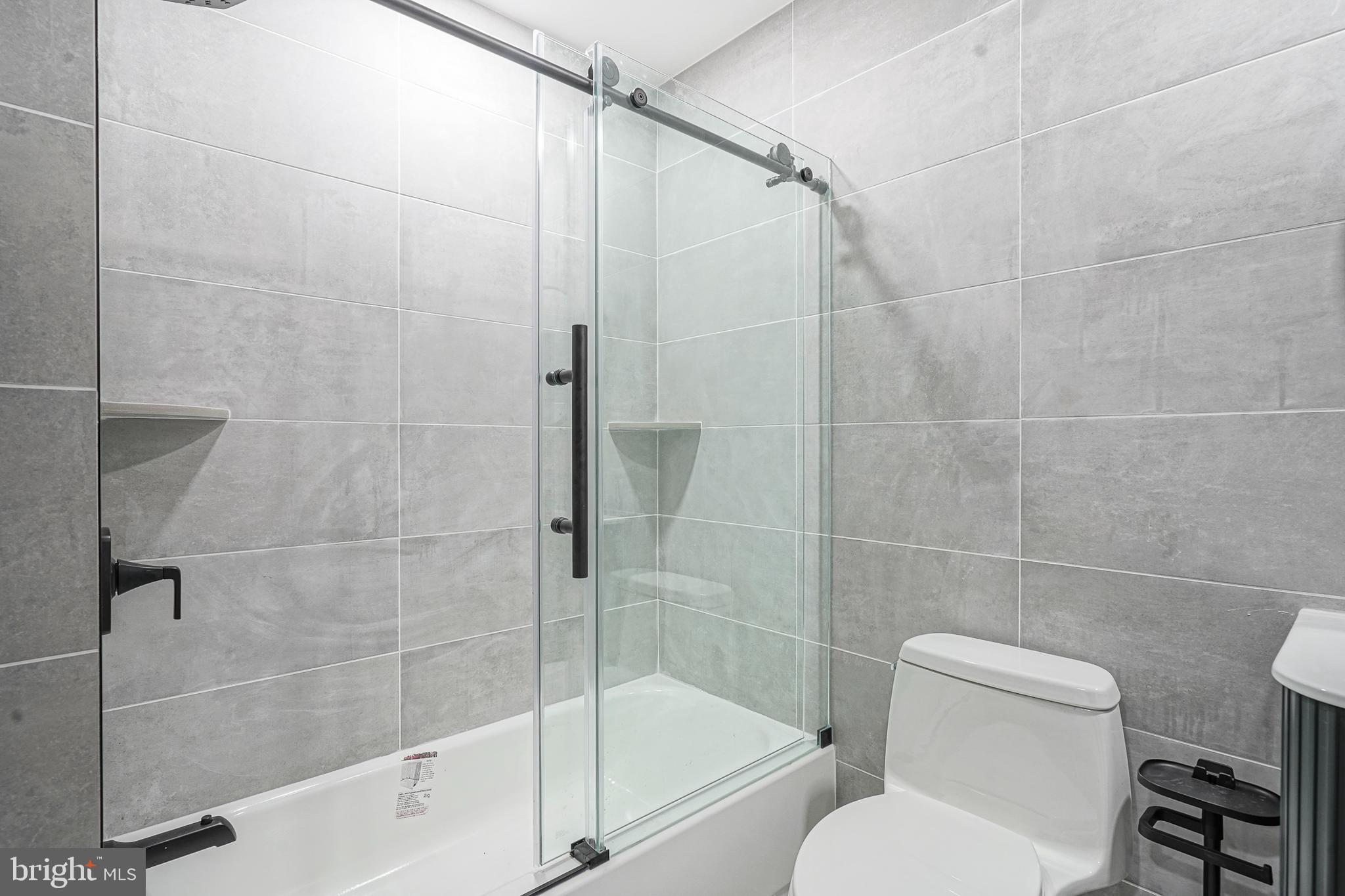 1145 Tasker Street Philadelphia, PA 19148 - Photo 30 of 58 a bathroom with a toilet and shower