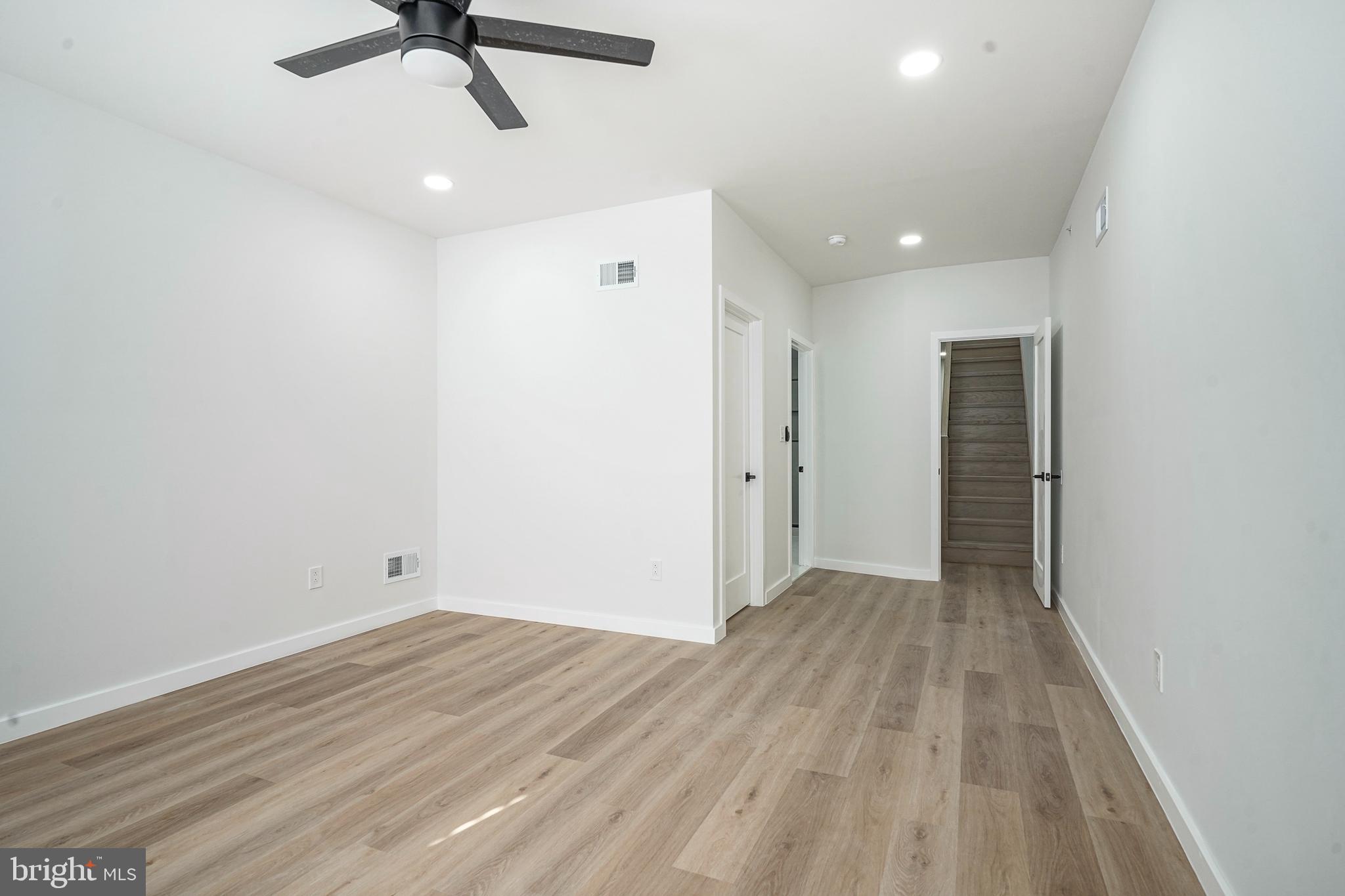 1145 Tasker Street Philadelphia, PA 19148 - Photo 32 of 58 wooden floor in an empty room with a window