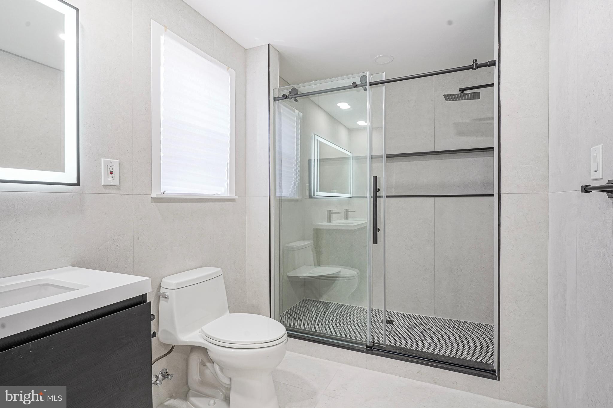 1145 Tasker Street Philadelphia, PA 19148 - Photo 35 of 58 a bathroom with a shower and toilet