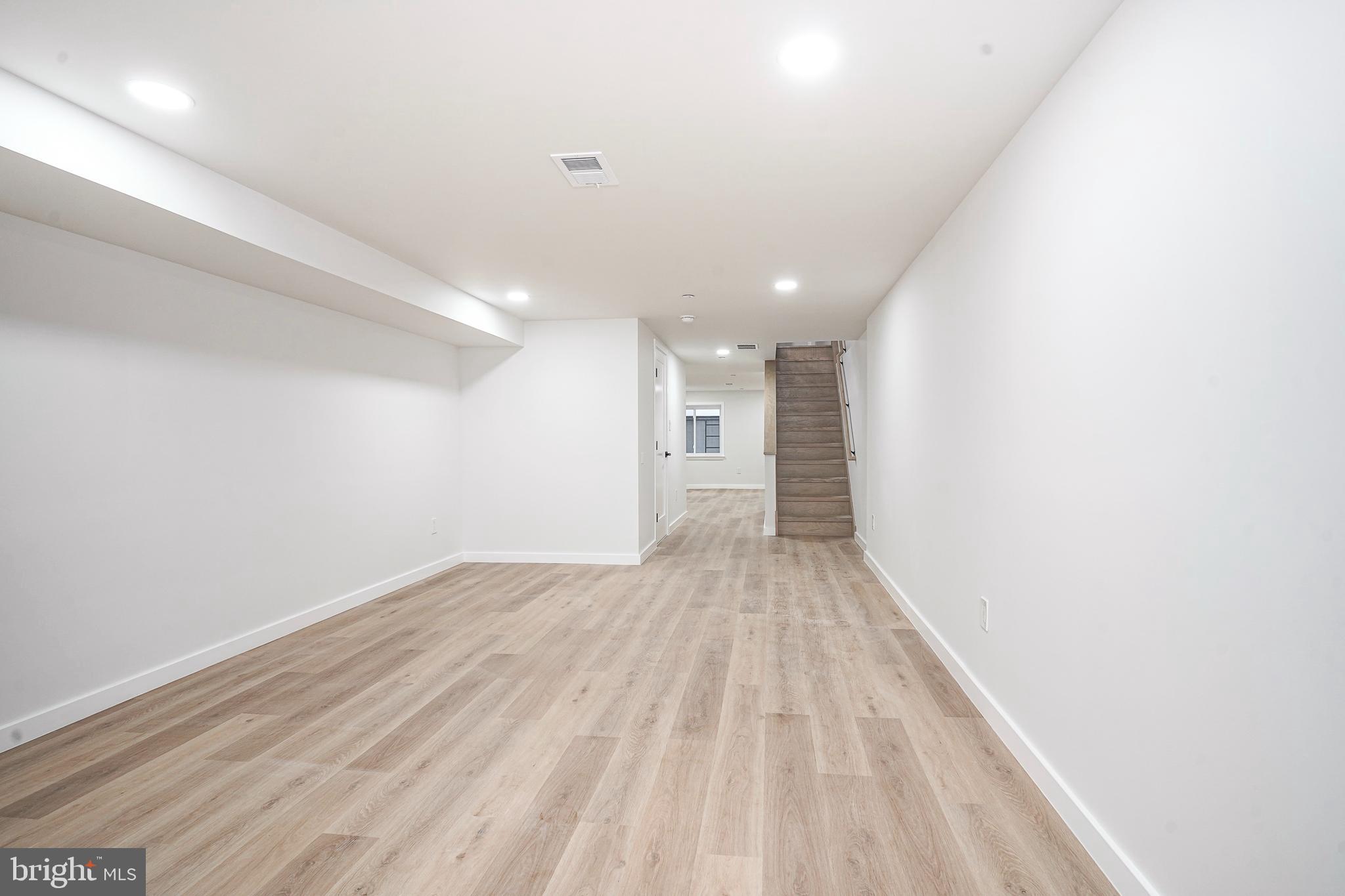 1145 Tasker Street Philadelphia, PA 19148 - Photo 40 of 58 a view of empty room with wooden floor