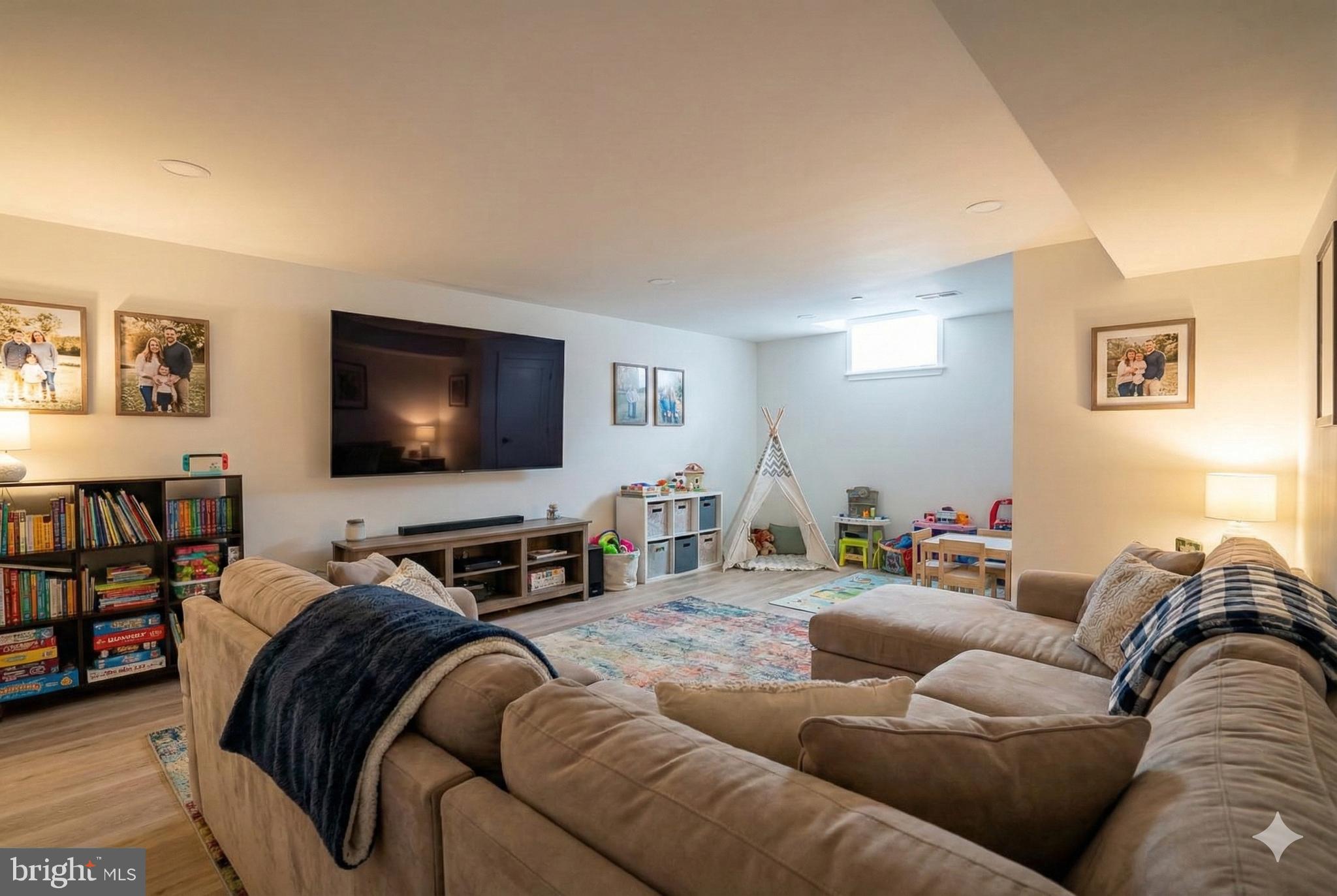 1145 Tasker Street Philadelphia, PA 19148 - Photo 45 of 58 a living room with furniture and a flat screen tv