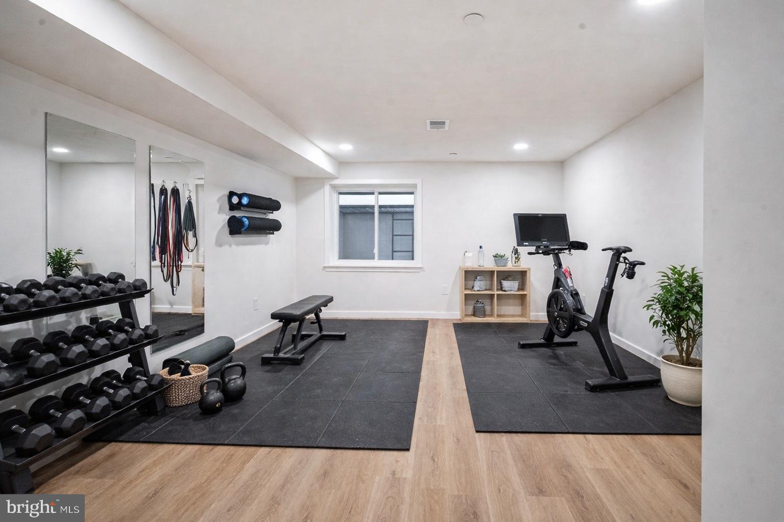 1145 Tasker Street Philadelphia, PA 19148 - Photo 46 of 58 a view of a livingroom with furniture and a gym cycle