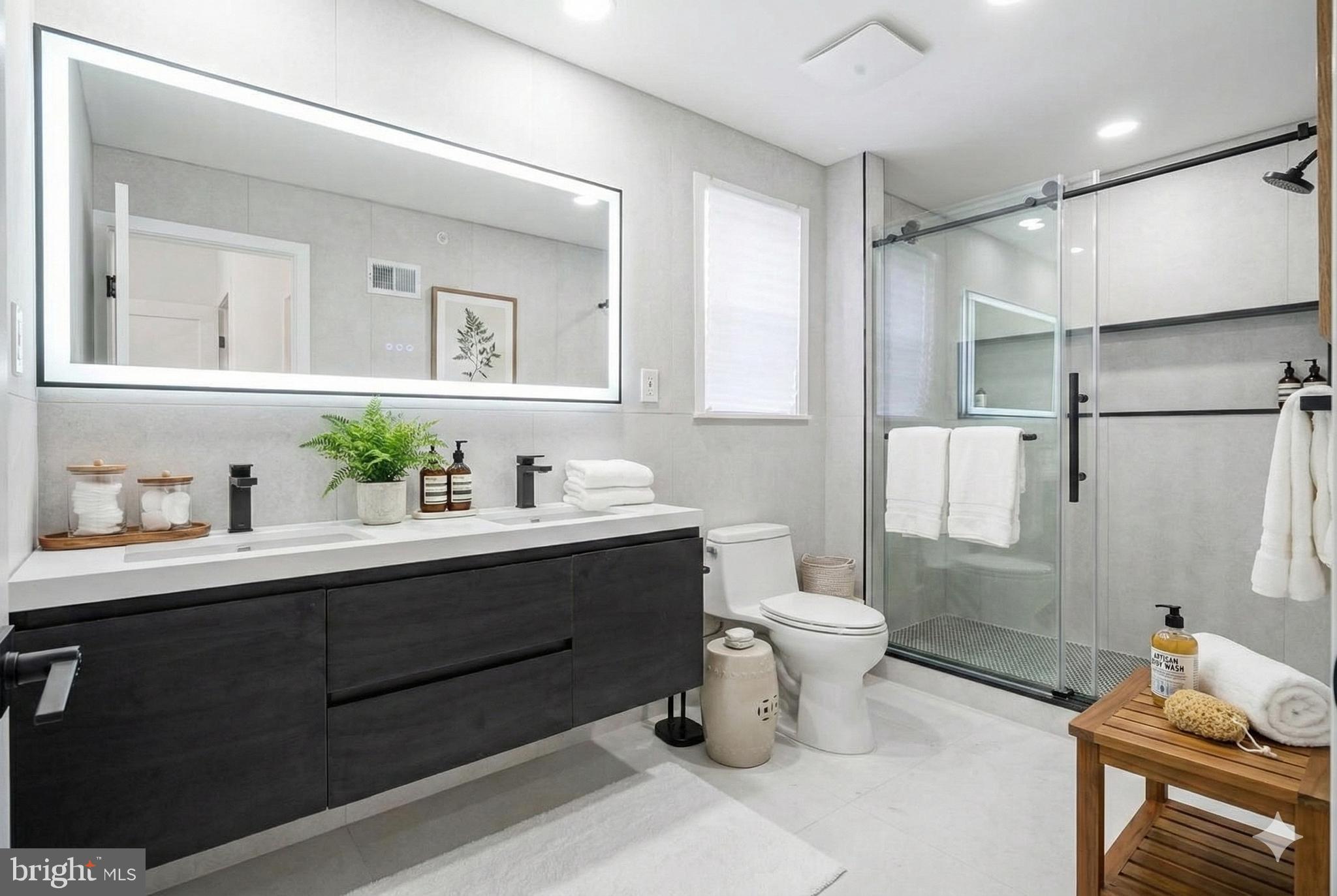 1145 Tasker Street Philadelphia, PA 19148 - Photo 48 of 58 a bathroom with a sink toilet and shower