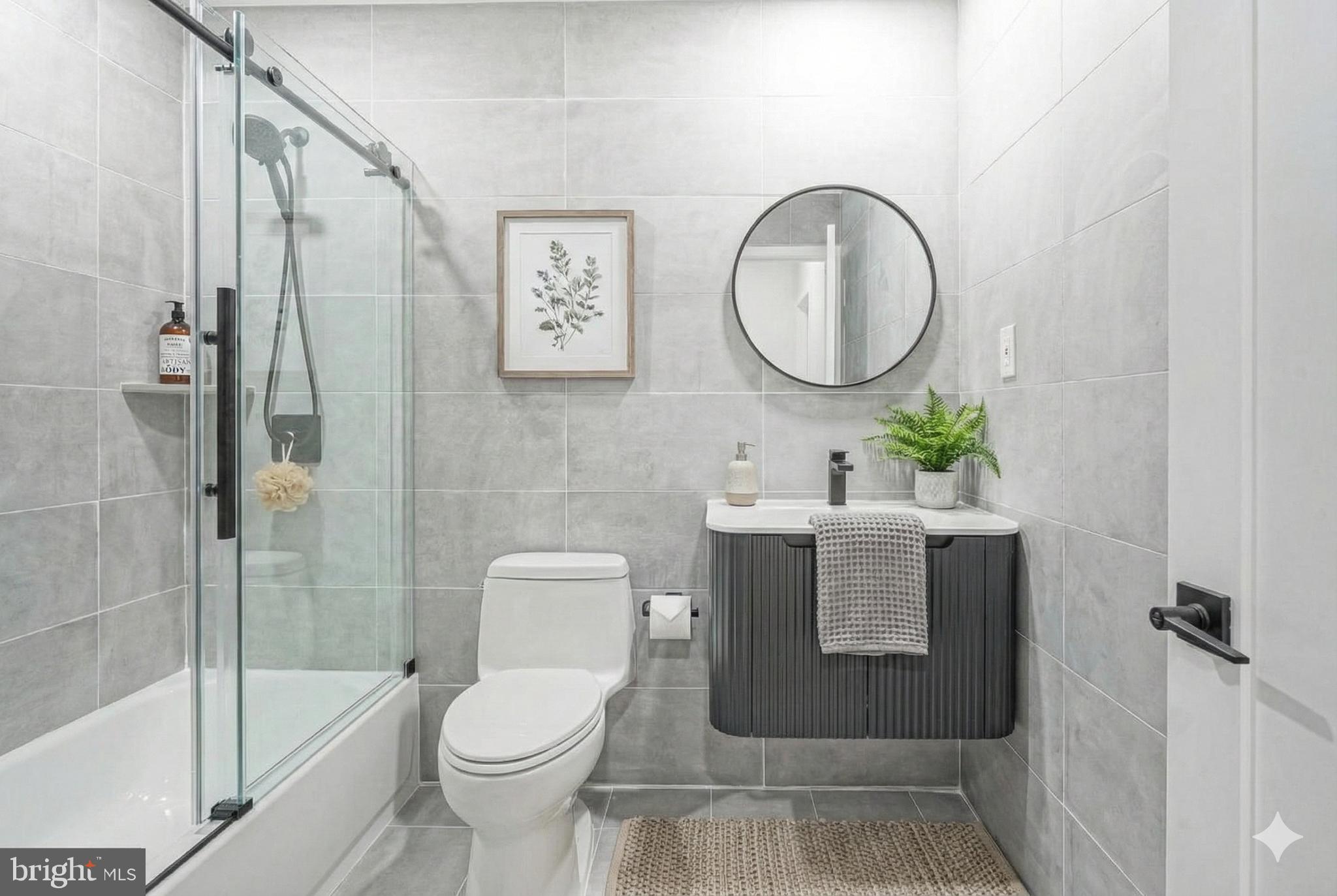 1145 Tasker Street Philadelphia, PA 19148 - Photo 50 of 58 a bathroom with a toilet sink and shower