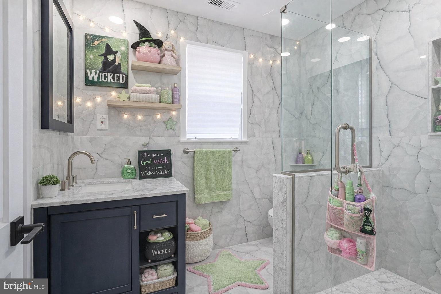 1145 Tasker Street Philadelphia, PA 19148 - Photo 52 of 58 a bathroom with a sink a vanity a mirror and shower