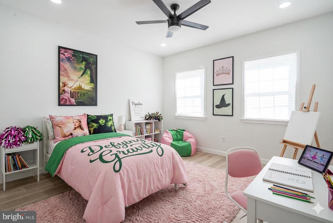 1145 Tasker Street Philadelphia, PA 19148 - Photo 53 of 58 a bedroom with a bed and a window