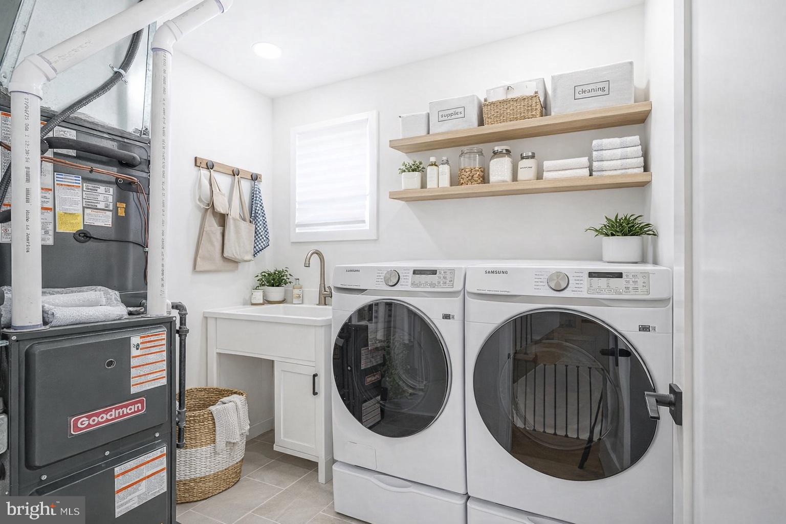 1145 Tasker Street Philadelphia, PA 19148 - Photo 54 of 58 a utility room with cabinets dryer and washer