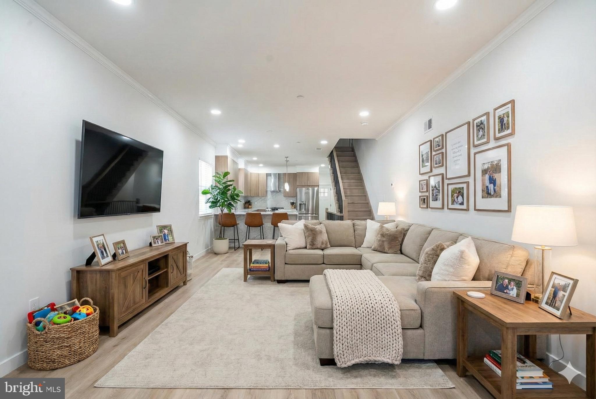 1145 Tasker Street Philadelphia, PA 19148 - Photo 58 of 58 a living room with furniture and a flat screen tv