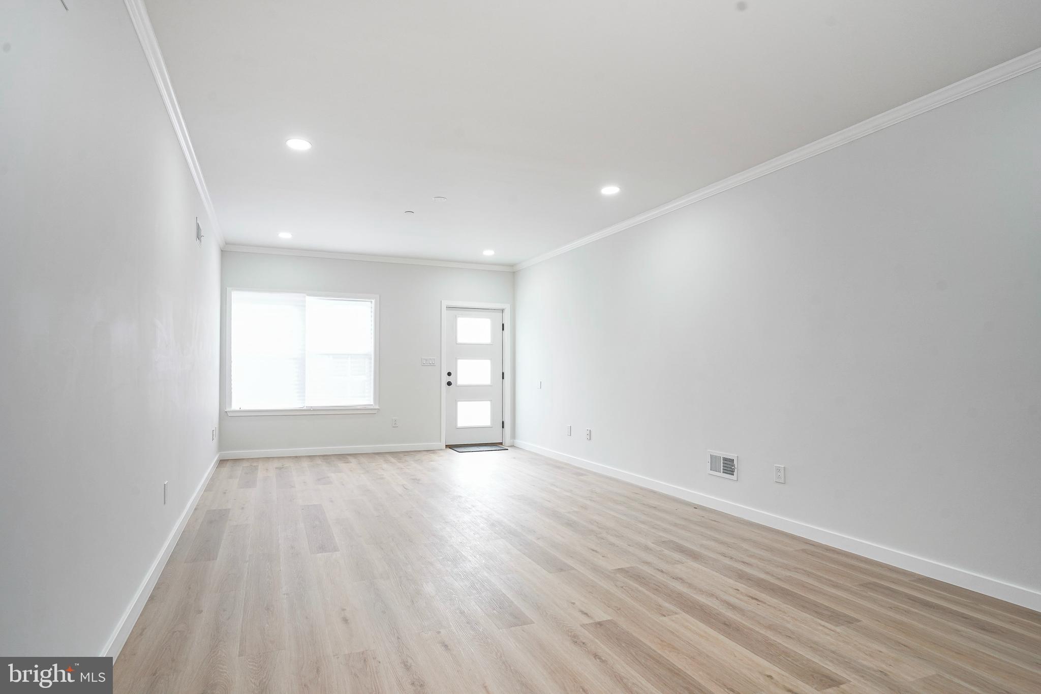 1145 Tasker Street Philadelphia, PA 19148 - Photo 6 of 58 a view of an empty room and a window