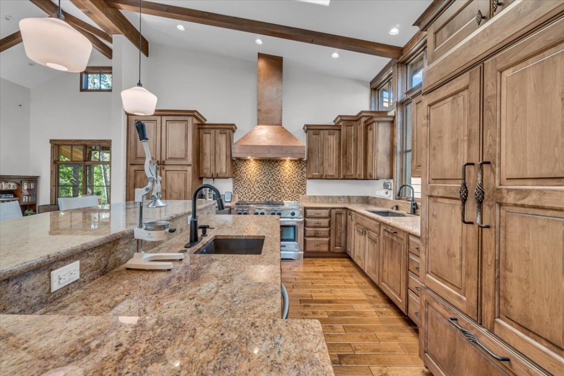 73 Last Chance Lane Dillon, CO 80435 - Photo 12 of 46 a kitchen with stainless steel appliances granite countertop a sink counter space cabinets and a stove