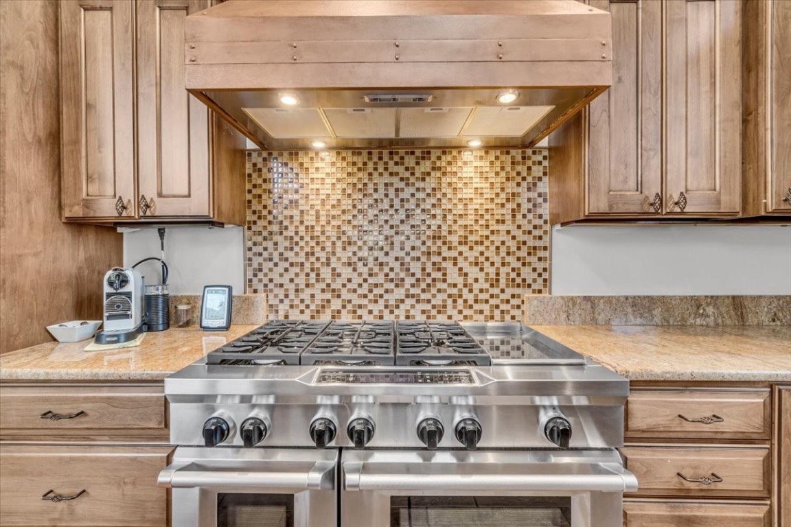 73 Last Chance Lane Dillon, CO 80435 - Photo 13 of 46 a stove top oven sitting inside of a kitchen