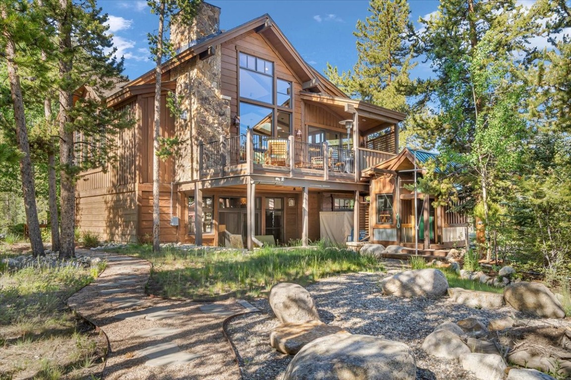 73 Last Chance Lane Dillon, CO 80435 - Photo 2 of 46 a view of a big house with many windows plants and large trees