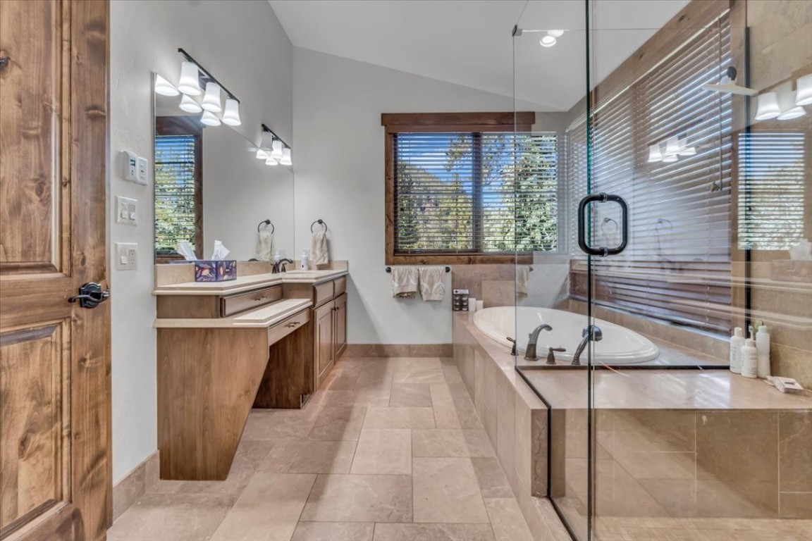 73 Last Chance Lane Dillon, CO 80435 - Photo 30 of 46 a spacious bathroom with a tub sink and mirror
