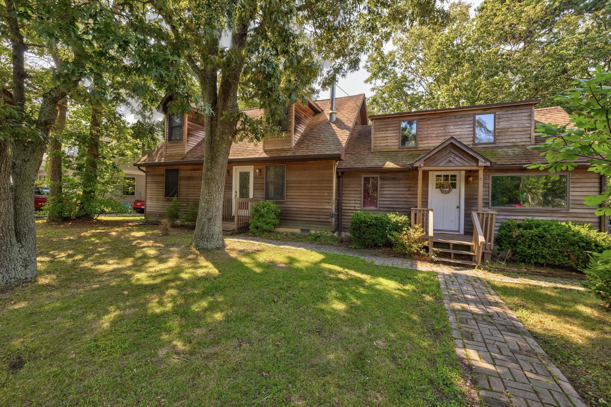 106 Delair Road Cape May, NJ 08204 - Photo 1 of 28 front view of a house with a yard