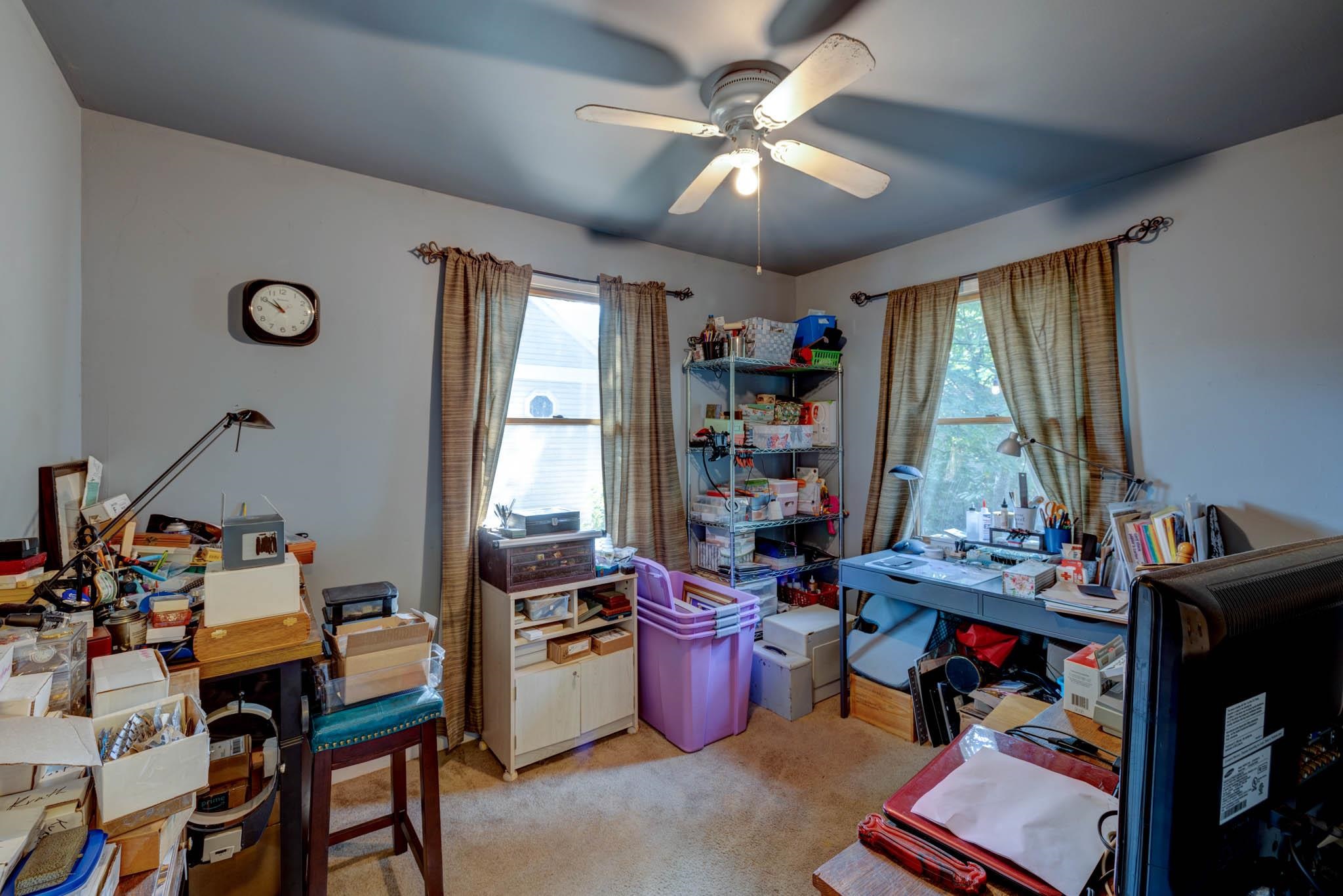 106 Delair Road Cape May, NJ 08204 - Photo 11 of 28 a view of a workspace with lots of furniture and a window
