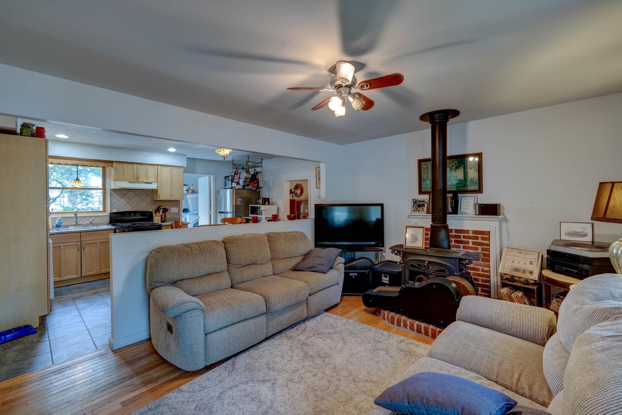 106 Delair Road Cape May, NJ 08204 - Photo 5 of 28 a living room with furniture and a flat screen tv