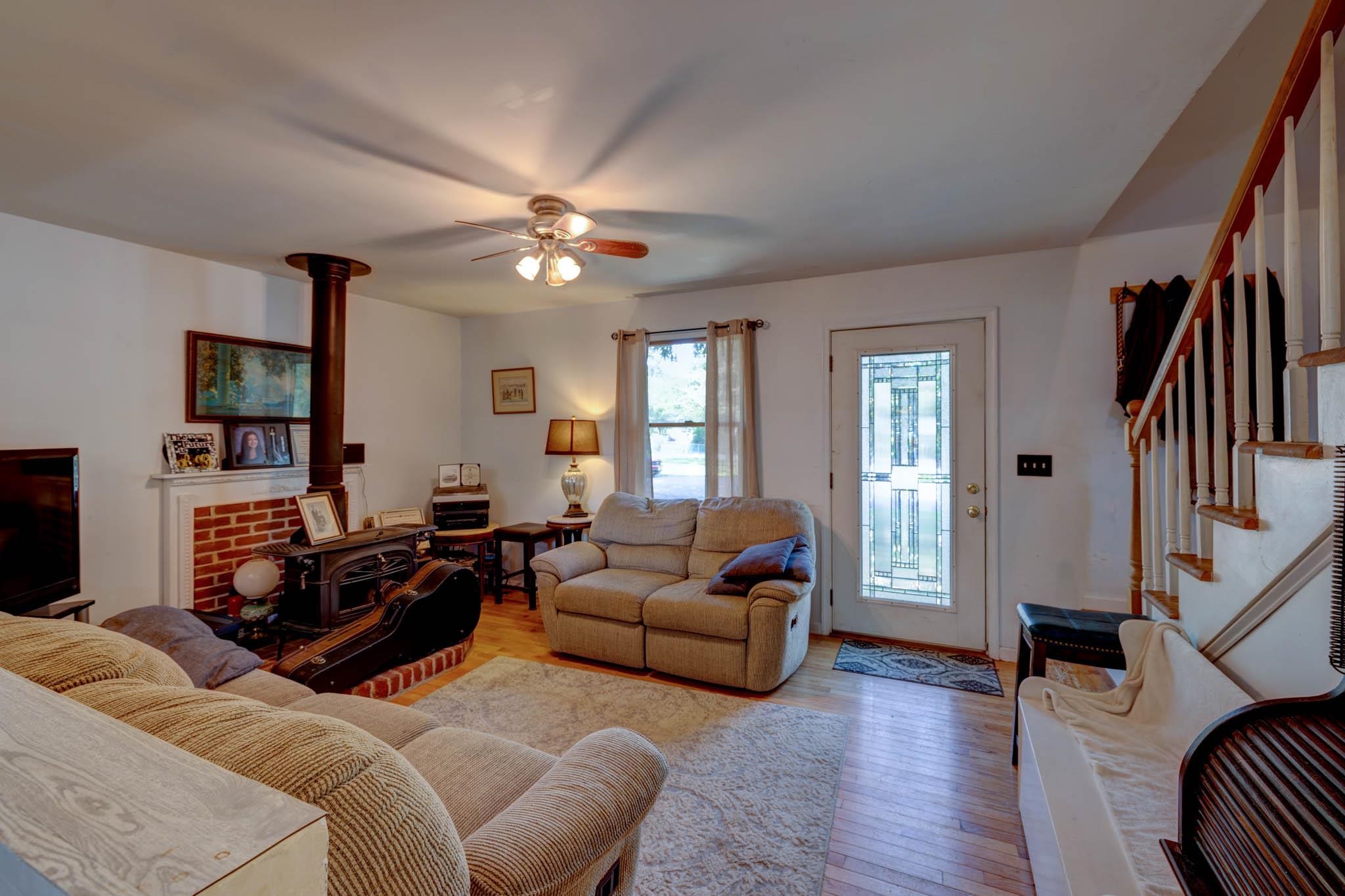 106 Delair Road Cape May, NJ 08204 - Photo 6 of 28 a living room with furniture ceiling fan and a wooden floor