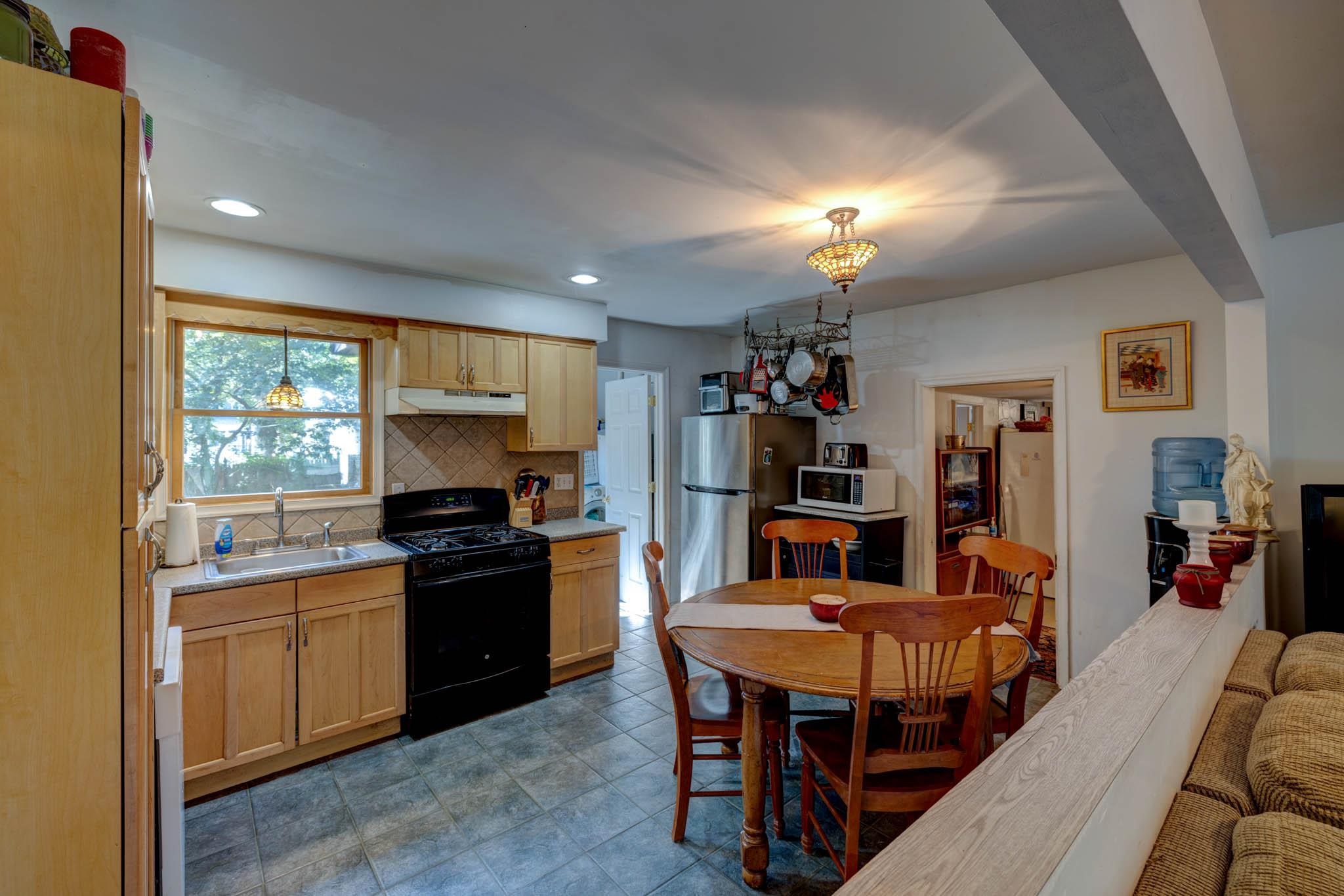 106 Delair Road Cape May, NJ 08204 - Photo 7 of 28 a kitchen that has a table and chairs in it
